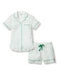 Elevate your nights with Petite Plumes Womens Twill Pajama Set in Match Point. This luxurious white cotton sleepwear features a green floral pattern, a short-sleeve button-up shirt with green piping and chest pocket, and matching shorts with a drawstring and piped hem.