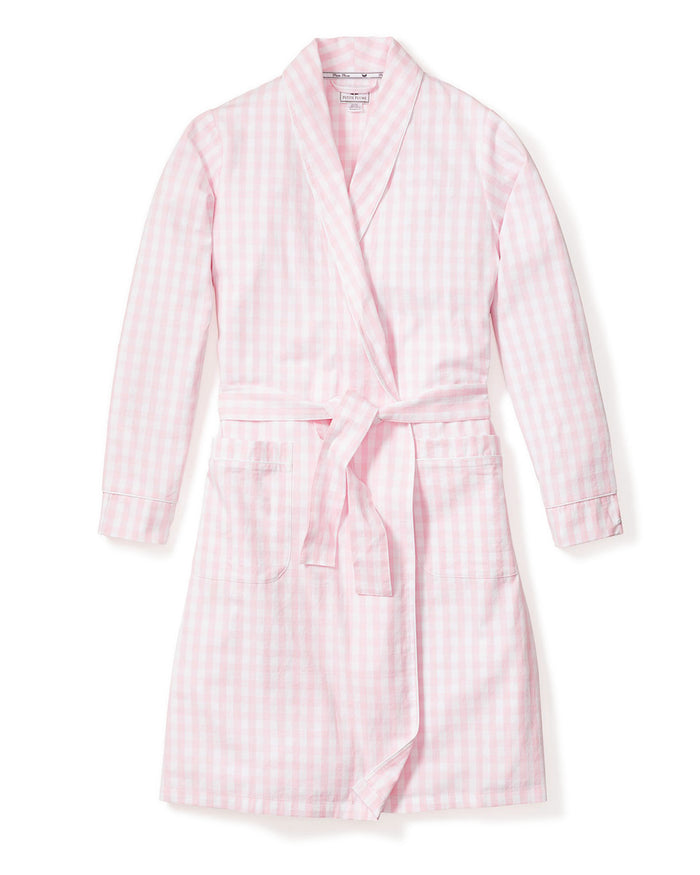 The Women's Twill Robe in Pink Gingham features long sleeves, a shawl collar, front pockets, and a matching fabric belt at the waist, shown laid flat on a white background.