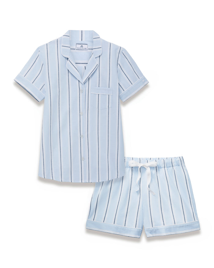 Women’s Twill Short Sleeve Short Set in Coastal Stripe, featuring a light blue pajama set with vertical navy and white stripes, short sleeves, white buttons, a chest pocket, and coordinating shorts with a white drawstring.