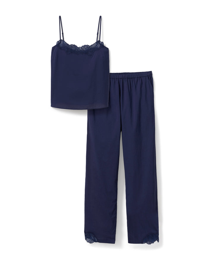 A woman stands barefoot against a plain light background, wearing the Women's Voile Fleur Cami Pant Set in Navy.